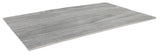 A rectangular, flat sheet of gray material with a subtle wood grain texture, this Frostone Collection Serving Tray is thin and lightweight, with one edge gently curved upward, evoking the look of a distressed wood tray in modern melamine.
