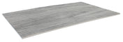 A rectangular, flat sheet of gray material with a subtle wood grain texture, this Frostone Collection Serving Tray is thin and lightweight, with one edge gently curved upward, evoking the look of a distressed wood tray in modern melamine.