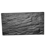 A rectangular, crinkled black slate display tray lies flat against a white background. Its wavy wrinkles and slightly glossy texture create striking patterns of light and shadow across the melamine surface.