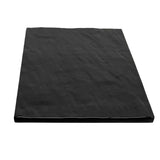A rectangular, flat black melamine sheet with a slightly wrinkled texture, shown against a white background. The sheet appears thin, flexible, and break resistant, with sharp corners and subtle surface creases visible.