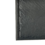 A close-up of a black padded bubble mailer, shown from the front and positioned vertically. The textured plastic surface has subtle creases, much like a break resistant melamine tray from the Frostone Collection Display Tray series.
