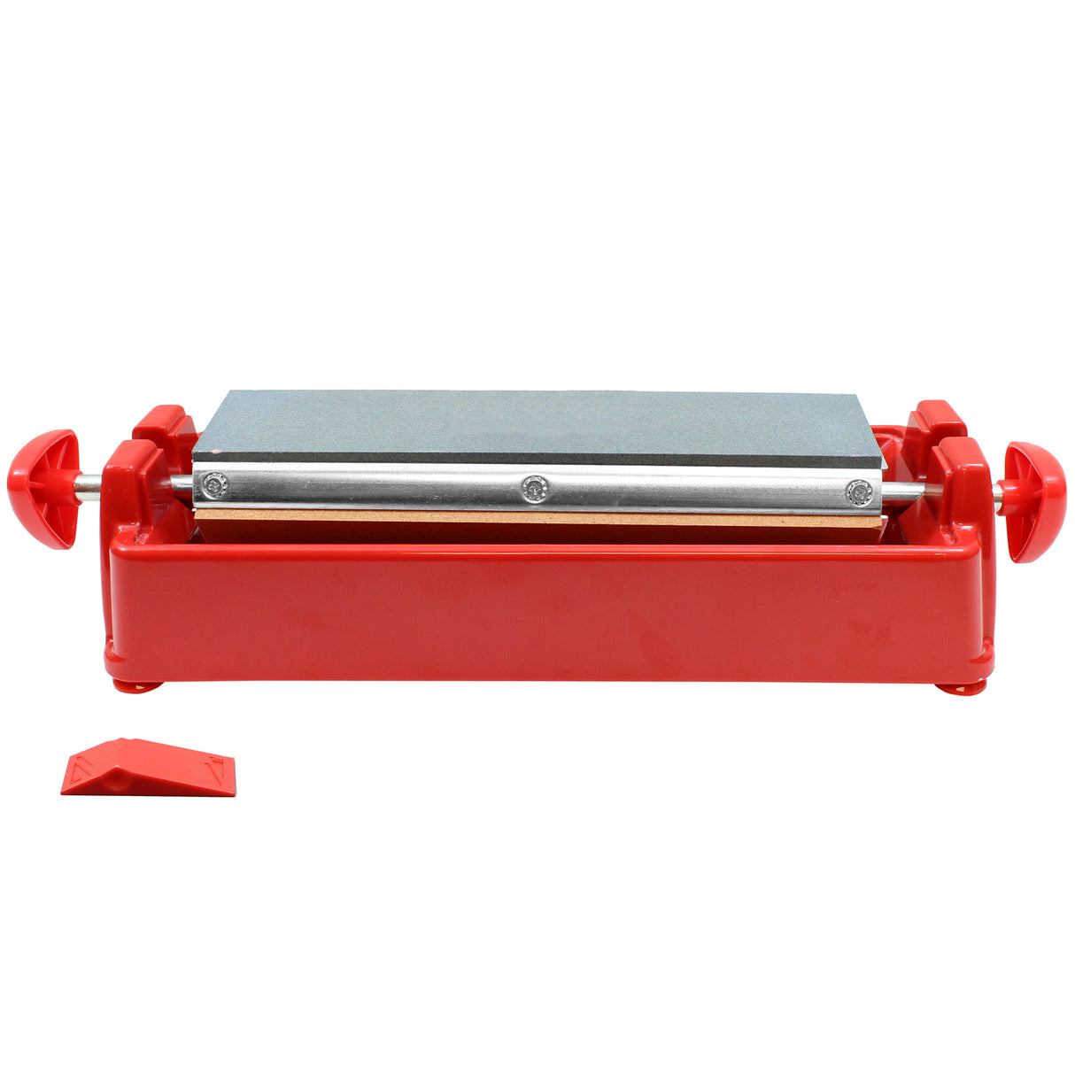 A rectangular sharpening stone with a gray surface is mounted in a red plastic base. This Three-Way Knife Sharpening System features two red knobs at each end and a small red wedge tool, displayed front view on a white background.