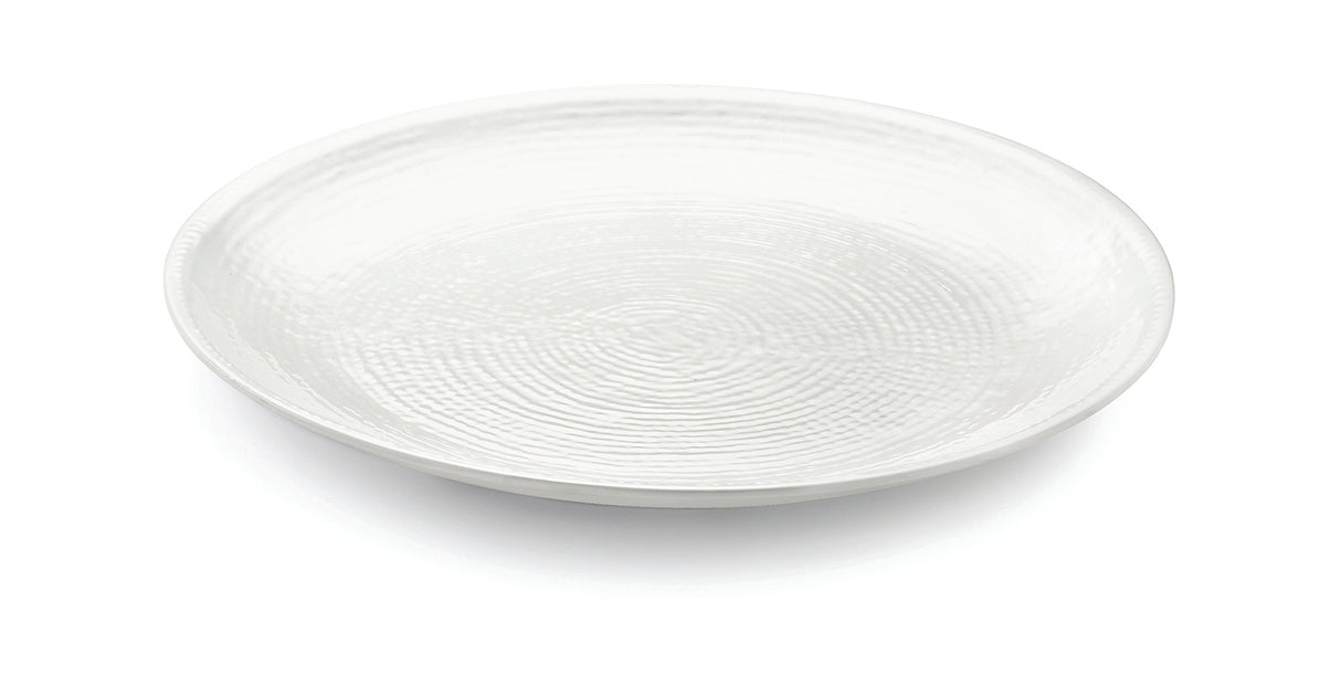 A plain, round, white ceramic plate from the Frostone Collection features a subtle textured pattern of concentric circles. Set on a white background, it is photographed at a slight angle to highlight its shallow depth and glossy surface.