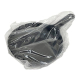 A black TableCraft skillet with a handle is wrapped in a clear plastic bag. The pan sits on a plain white background and appears new, with smooth, shiny surfaces visible through the packaging.