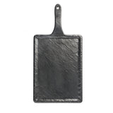 A rectangular, black slate Frostone Collection Serving Paddle with a handle and a small hanging hole. Its rough, textured finish and slightly uneven edges create a natural, handcrafted look. The background is plain white.