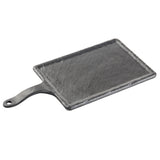 A rectangular, flat, black slate Frostone Collection Serving Paddle with a short handle featuring a hole at the end. The textured surface is slightly uneven, and the board is angled on a white background.