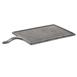 A rectangular, textured Frostone Serving Paddle in dark gray with a raised handle on the left side. The board mimics black slate’s rustic look with slightly uneven edges and a rough, hammered surface—perfect as a stylish melamine platter.