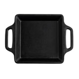 A square, black cast iron baking dish with two rectangular handles on opposite sides. The matte cast iron coating is unadorned, and the dish is viewed from directly above against a white background.