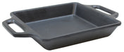 A black, square cast iron baking dish with two wide handles sits on a white background. The dish has straight sides and a matte cast iron coating, giving it a sturdy, functional appearance suitable for baking or roasting.