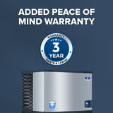 A commercial ice machine with a touchless lever stands against a blue background. Above, bold white text reads, ADDED PEACE OF MIND WARRANTY. Below is a blue and white circular badge stating, WARRANTY 3 YEAR PARTS & LABOR.