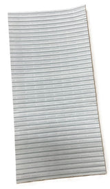 A rectangular sheet of light gray, flexible material from a Manitowoc Bag Kit with evenly spaced, thin horizontal ridges. Photographed against a white background, the sheet appears slightly curved along its length and is used for ice bag ties.