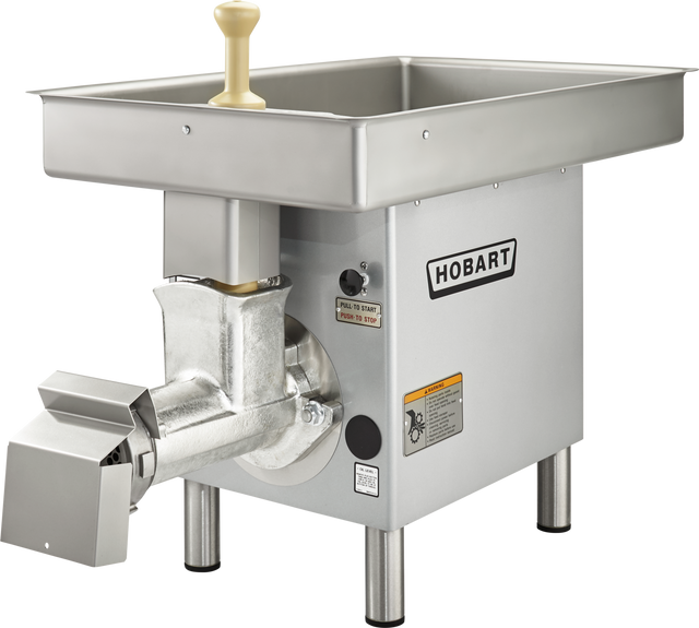 A Hobart Meat Grinder with a 3 HP motor and large rectangular tray, featuring sturdy metal legs, safety labels, yellow handle, and an industrial design. This stainless steel grinder handles up to 35-40 lb/min capacity with its efficient discharge tube.