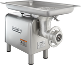 A stainless steel Hobart bench type Meat Chopper with a large rectangular tray on top, a grinding mechanism at the front, and sturdy legs. Featuring a powerful 1-1/2 HP motor, it’s built for heavy-duty food processing with clear branding and warning labels.