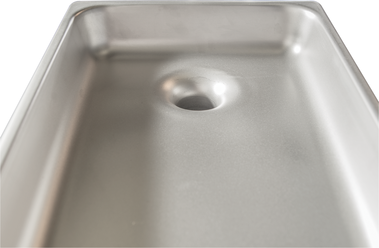 Close-up view of a clean, empty Hobart stainless steel sink with smooth, reflective surfaces and a centered drain hole. The gently rounded edges and metallic texture echo the quality found in a Rectangular Grind Pan, emphasizing depth and durability.