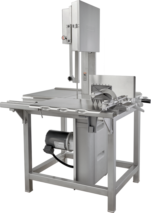 The Hobart 6614-1IP commercial meat band saw features a stainless steel frame, large cutting table, integrated pusher, adjustable fence, and vertical blade. It operates on 200-230/60/3 voltage with a motor below the table and safety blade guards.