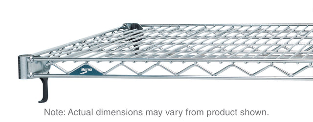 Close-up of a chrome plated Super Erecta Shelf with a Metro logo on the edge. The adjustable wire shelf features a grid design, reinforced border, and black plastic corner caps. Below, text reads: Note: Actual dimensions may vary from product shown.