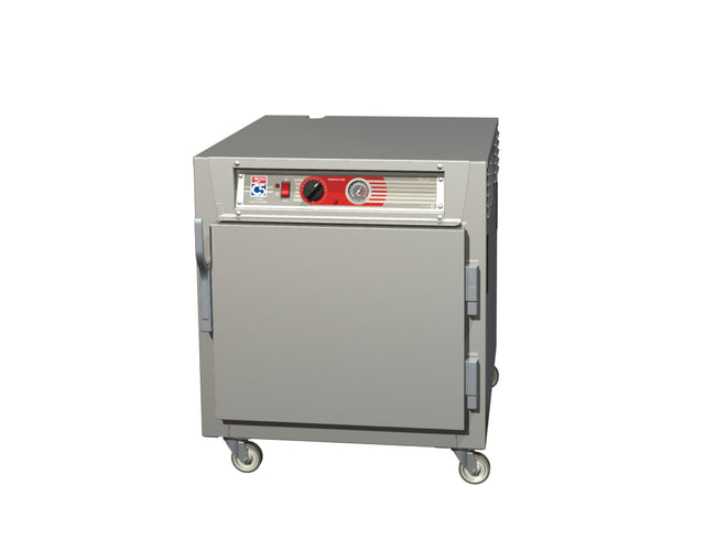 A Metro C5 6 Series stainless steel heated holding cabinet on wheels, featuring a front door, large metal handles, and a control panel with knobs and a gauge above the door, is shown against a plain white background.