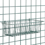A rectangular SmartWall Storage Basket is attached to a metal grid wall. Made of thin metal rods with a minimalist design, the basket features Metroseal 3 antimicrobial protection for safe and organized storage.