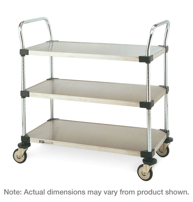 The Metro MW203 utility cart features three flat rectangular stainless steel shelves, dual handles, and four caster wheels. The cart is empty with a plain white background. Text below states: “Note: Actual dimensions may vary from product shown.”.