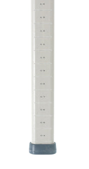 A close-up of a MetroMax compatible silver metal pole with horizontal black measurement markings labeled 0.4 to 1.6 in 0.1 intervals. The polymer trilobal post ends in a gray plastic or rubber base. The background is white.