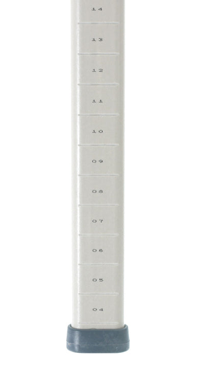 A close-up of a MetroMax compatible silver metal pole with horizontal black measurement markings labeled 0.4 to 1.6 in 0.1 intervals. The polymer trilobal post ends in a gray plastic or rubber base. The background is white.