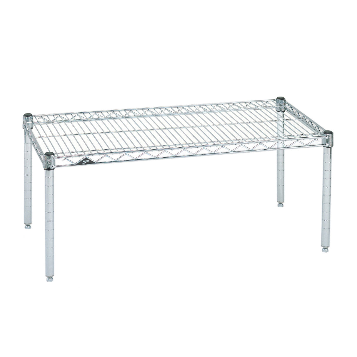 A chrome wire shelf with four metal legs, rectangular in shape. The open grid design resembles a Super Erecta Dunnage Rack, allowing for ventilation. NSF-certified, the sturdy wire platform is ideal for storage or organizational use. Background is plain white.