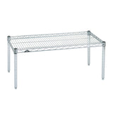 A chrome wire shelf with four metal legs, rectangular in shape. The open grid design resembles a Super Erecta Dunnage Rack, allowing for ventilation. NSF-certified, the sturdy wire platform is ideal for storage or organizational use. Background is plain white.