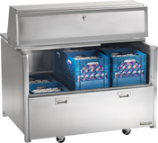 A stainless steel milk cooler with wheels, open to reveal two blue crates filled with cartons of milk. Featuring forced-air cooling, it has an upper compartment with a sliding door and a lower pull-down door with two handles.