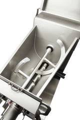 A stainless steel industrial food mixer with a 150 lb capacity is shown from above. Inside, metal mixing arms and a spiral auger are visible, designed for blending or kneading ingredients. The surfaces are clean and the machinery appears unused.