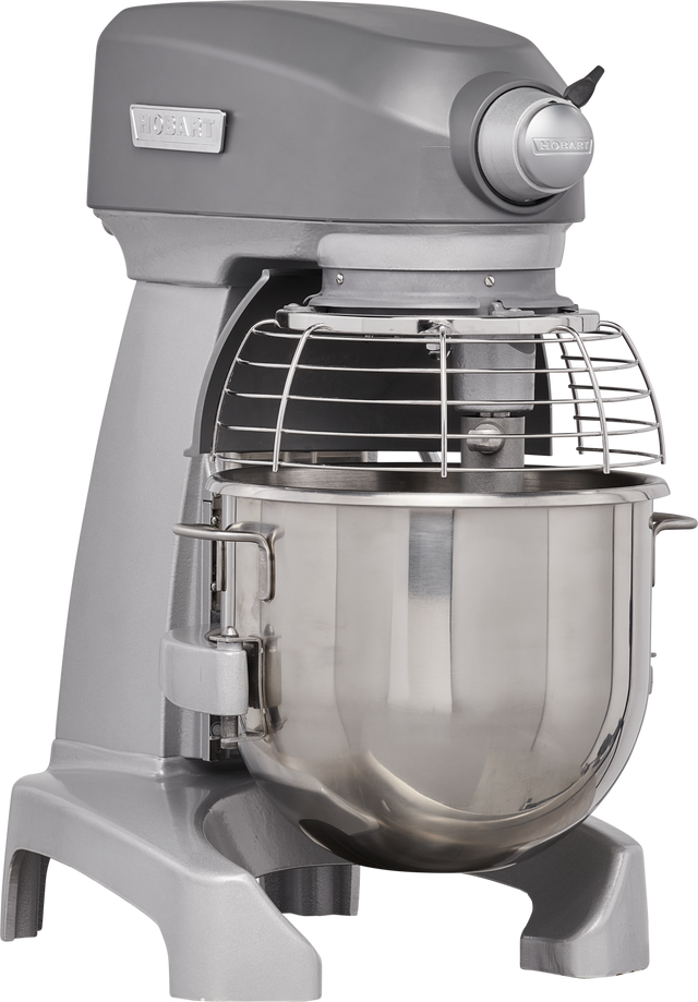 A commercial-grade gray planetary mixer with a large 20 quart stainless steel mixing bowl, protective wire guard, and control knobs. The Hobart logo is visible on the front, and the bench mixer stands on sturdy legs for stability.