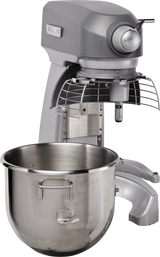 A large, industrial gray 20 quart mixer with a metal safety guard and a detachable shiny stainless steel mixing bowl placed in front. This sturdy planetary mixer features a robust base and control panel, perfect for heavy-duty kitchen use.