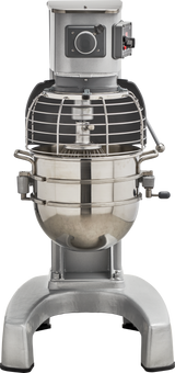 A commercial 30 qt mixer with a large stainless steel mixing bowl, protective wire guard, control panel, and sturdy metal base. The Hobart HL300 Legacy Planetary Mixer looks industrial and heavy-duty, with the bowl attached and a mixing attachment inside.