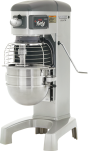 A sturdy Hobart HL300 planetary mixer with a 30 quart stainless steel bowl, wire guard, grey metal body, control panel with knobs and buttons, and a side lever for lifting the bowl—designed for heavy-duty commercial mixing tasks.
