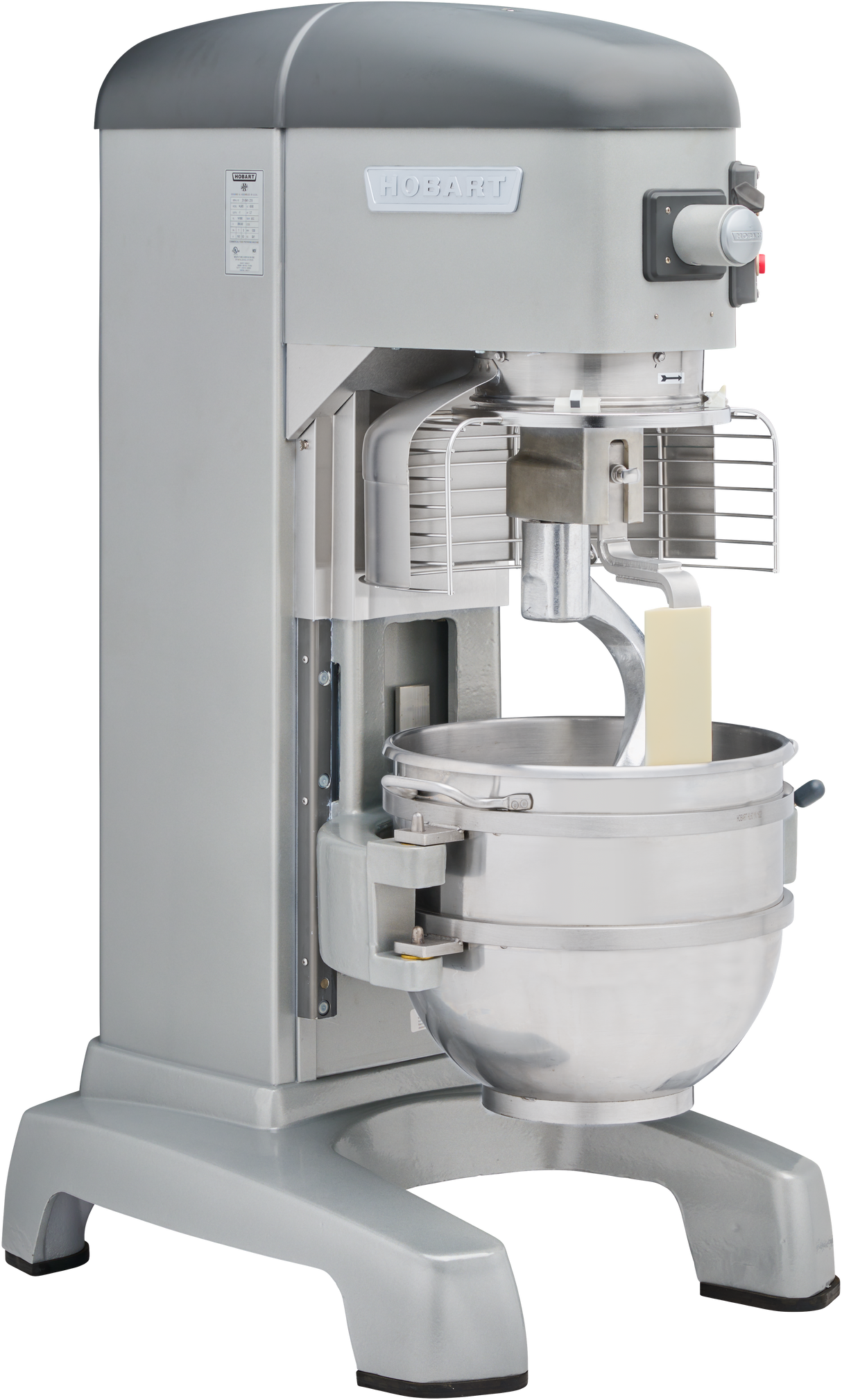 A large, silver Hobart Legacy Planetary Mixer with a metal mixing bowl, safety guard, and attached paddle beater. The 60 qt mixer features control buttons on the upper right, a sturdy base, and a rectangular block of butter inside the bowl.