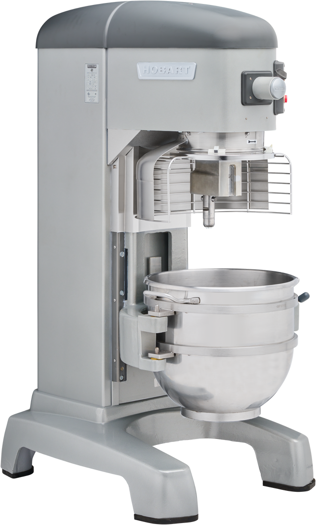 A large Legacy Correctional Planetary Mixer with a metallic finish, protective wire guard, control buttons, and a 60 quart mixer bowl is angled on a white background—ideal for commercial kitchen use.
