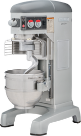 A large 60 quart planetary mixer with a stainless steel bowl, dough hook attachment, and safety guard. This Hobart mixer is gray, features control knobs and buttons on the front panel, and stands on a sturdy base.