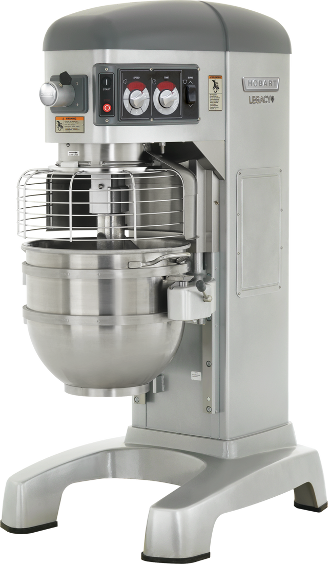 A large, silver Hobart Legacy pizza planetary mixer features a protective metal cage over its 60 quart stainless steel mixing bowl. The control panel has red and black buttons and dials, while the mixer stands on a wide, sturdy base.