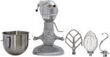 A Hobart N50 mixer is shown with its mixing bowl and three metal attachments—flat beater, wire whisk, and dough hook—arranged in a row from left to right on a white background. The 5 quart mixer bowl is detached and placed on the far left.