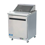A stainless steel Arctic Air AST28R salad prep table with a hinged top lid, single door, and four caster wheels. The unit features a blue label near the bottom and a control panel, ideal for restaurant or kitchen use.