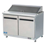 A commercial stainless steel Arctic Air AST48R sandwich prep table with two doors, a smooth white countertop, a raised covered section for ingredients, and small wheels for mobility. The unit looks clean and sits against a plain white background.