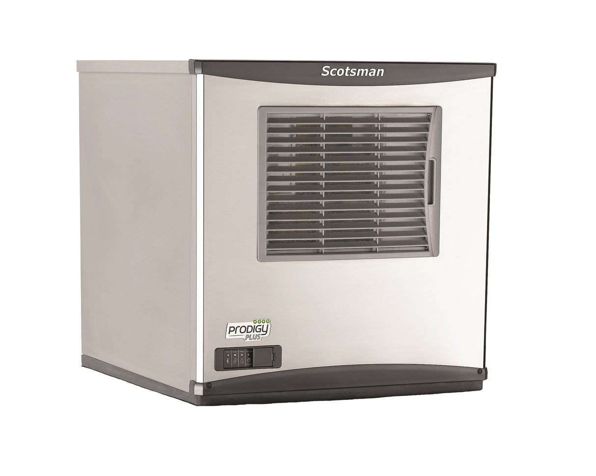 A stainless steel Scotsman commercial ice maker with a front vented grill, digital control panel, and the “Prodigy Plus” label on the lower left. The modern, boxy unit with black trim is perfect for producing chewable ice in any setting.