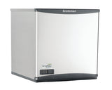 A stainless steel Scotsman nugget ice maker with a smooth, slightly curved front panel, digital control display at the lower left, and “Scotsman” branding at the top. Compact and modern, it delivers soft chewable ice in a sleek boxy design.