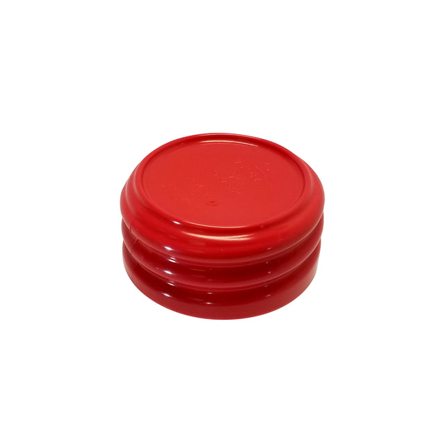 A bright red, round plastic lid with a raised edge and two indented grooves around its side, is shown upside down against a plain white background. This StorMaster lid is dishwasher safe for easy cleaning.