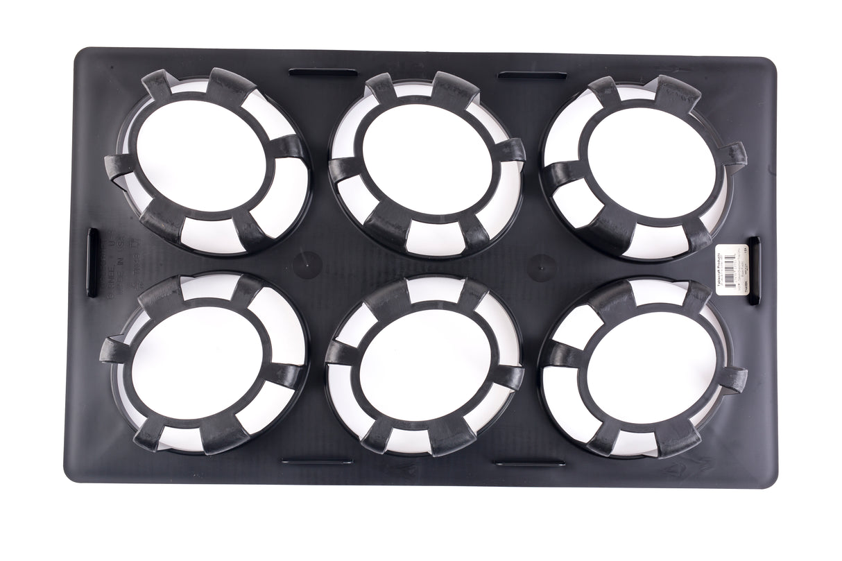 A black rectangular tray with a durable polycarbonate body features six round openings, each ringed by alternating black and white segments resembling poker chips. The tray lies flat on a white background, with a barcode sticker on the right edge.