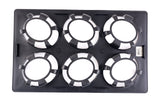 A black rectangular tray with a durable polycarbonate body features six round openings, each ringed by alternating black and white segments resembling poker chips. The tray lies flat on a white background, with a barcode sticker on the right edge.