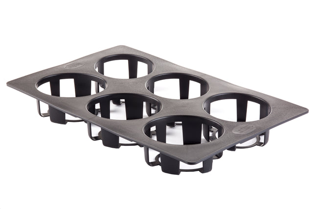 A black, rectangular silicone mold with six round cavities, each supported by sturdy rings and open bottoms. The dishwasher safe design is angled slightly, showing its depth and the open structure beneath each cavity.