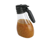 A BPA Free Salad Dressing Dispenser, 48 oz., filled with a chunky brownish-orange liquid, features a black handle and flip-top lid. The clear plastic container resembles a syrup dispenser and is set against a plain white background.