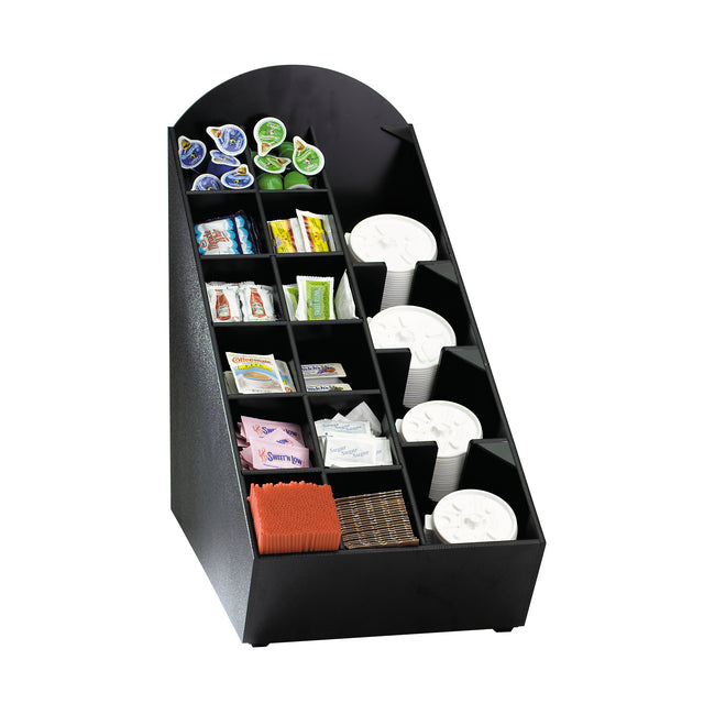 A black condiment organizer with multiple compartments neatly holds coffee creamers, sugar packets, stirrers, condiment packets, and stacked white disposable cups with lids, keeping everything separated and easy to access.
