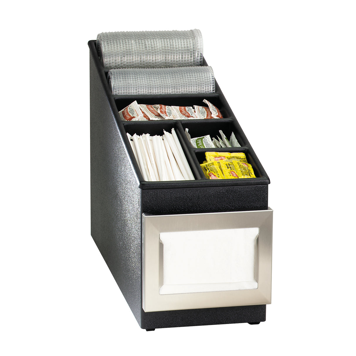 A black and silver countertop condiment organizer contains wrapped straws, napkins, condiment packets like sugar and salt, and plastic stirrers in separate compartments. A napkin dispenser is built into the front. Rolls of shelf liner rest on top.