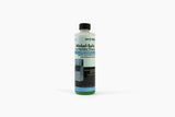 A bottle of Ice-O-Matic Nickel-Safe Ice Machine Cleaner with a black cap. The blue and green label highlights its food-grade formula, usage instructions, and an ice machine image. The bottle stands upright on a white background.